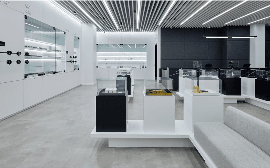 Photo of an interior space with black and white panels and a a baffle system ceiling. All provided by Longboard Architectural Products.